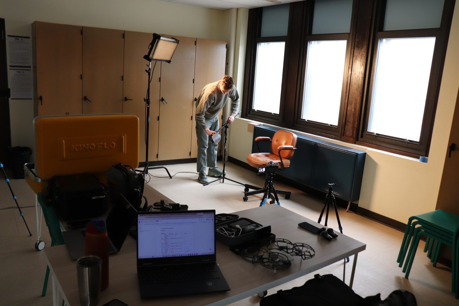 Videographer Ben Geise Setting Up Equipment For Filming Interviews