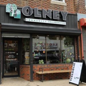 Creative Repute signage for Olney Community Collaborative display storefront using logo