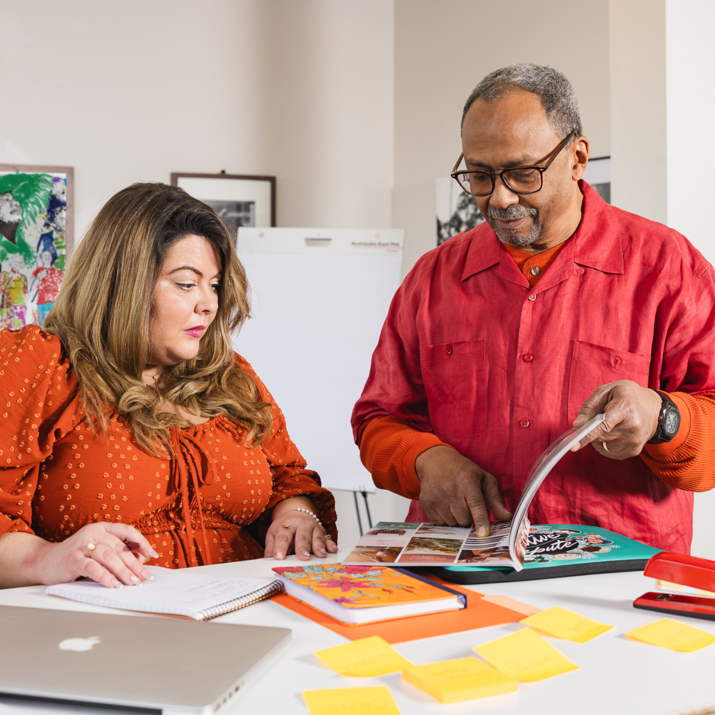 Creative Repute consultant and digital marketing specialist, Kristina Hernandez, reviewing marketing strategy materials with a client as part of marketing readiness and advertising budget planning.