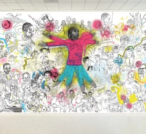 Mural design at The Children’s Hospital of Philadelphia (CHOP) featuring a person in a red shirt and blue pants in motion, surrounded by several people's faces.