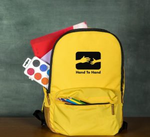 hands 2 hand back school supplies merch nonprofit fundraiser philadelphia back pack school bag yellow
