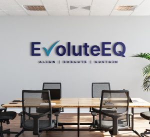 EvoluteEQ dimensional office signage designed by Creative Repute displayed above a conference room table